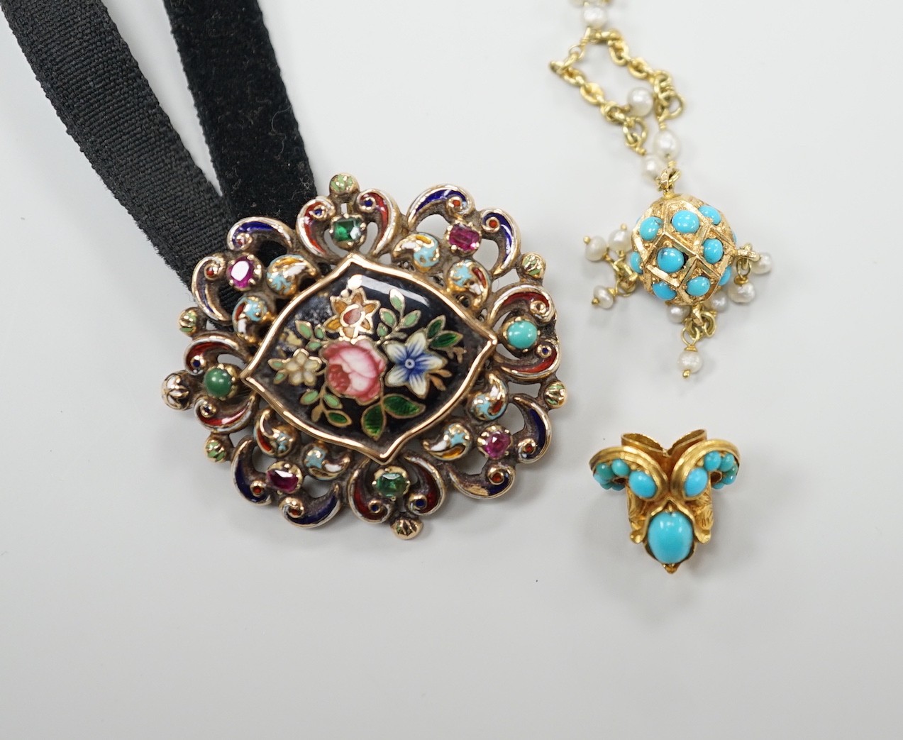 A Victorian yellow metal, enamel and gem set brooch, 37mm, with black sash, together with a yellow metal, turquoise and seed pearl set pendant necklace and a yellow metal and turquoise set small pendant on a damaged 9ct